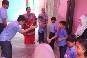 Some students of DCF Learning Center are playing with their teachers and caregivers